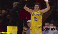 a basketball player wearing a lakers jersey celebrates