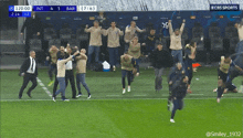 a group of people on a soccer field with a cbs sports logo in the background