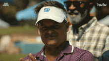 a man wearing a chad powers hat looks at the camera