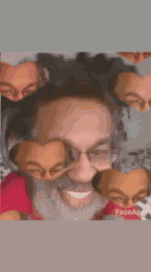 a close up of a man with glasses and a beard smiling