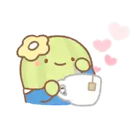a green cactus with a flower on its head is holding a white cup of tea