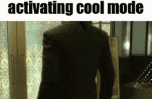 a picture of a man in a suit with the words activating cool mode below him