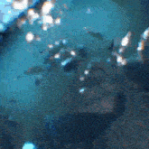 a pixelated image of a body of water with bubbles coming out of it
