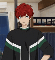 a boy with red hair is wearing a black shirt with green and white stripes