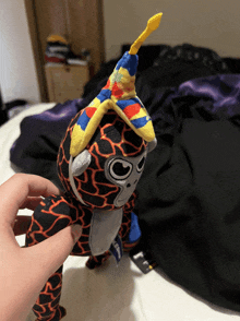 a stuffed animal with a colorful party hat on it