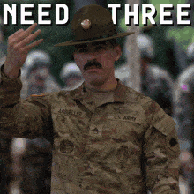 a soldier with the name arbuelles on his uniform waves