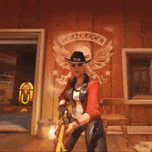 a woman in a cowboy hat is holding a gun in front of a wooden wall with a logo on it .