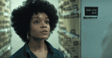 a woman stands in front of a file cabinet with the number 4319