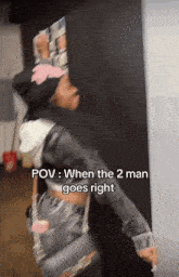 a woman in a black jacket is standing in front of a wall with the words pov when the 2 man goes right
