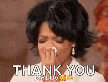 oprah winfrey is crying while holding a tissue in her hand .