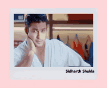 a picture of a man with the name sidharth shukla on the bottom right