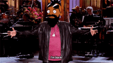 a cartoon character with a beard says " i 'm back "