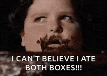 a man with chocolate on his face is saying `` i can 't believe i ate both boxes !! ''