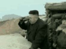 Obama Kim Jong Un GIF - Obama Kim Jong Un Binoculars GIFs
