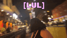 a woman walking down a street with the word lul written on the bottom