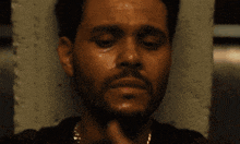 a person is holding a cell phone with a picture of a man laying on a couch and the words talk to me on the screen