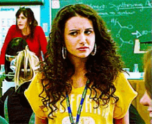 a girl with curly hair wears a yellow shirt that says ' i 'm a ' on it