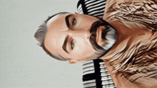 a drawing of a man with a beard and a striped shirt