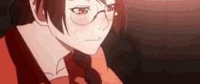 a close up of a girl wearing glasses and a red dress .