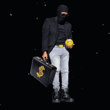 a man in a mask holding an apple and a briefcase with a dollar sign on it