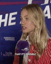 a woman talking into a microphone with the words that it 's possible
