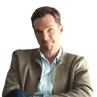 a man with his arms crossed is wearing a tan jacket and blue shirt