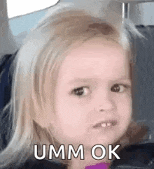 a little girl with blonde hair is making a funny face and saying umm ok .
