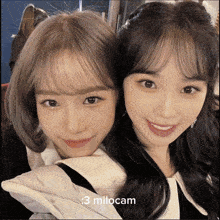 two girls are posing for a picture and the caption says : 3 milocam