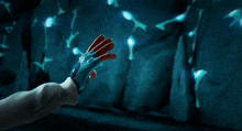 a robotic hand reaches out to a human hand