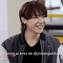 a young man is smiling with the words sonrie si eres de @yixiangatito