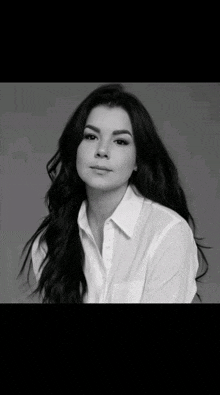 a black and white photo of a woman with long hair