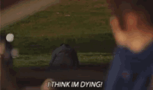 a man is sitting in a car and says i think im dying
