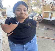 a girl with a black shirt that says big on it