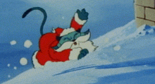 a cartoon cat dressed as santa claus is sliding down a snowy hill .