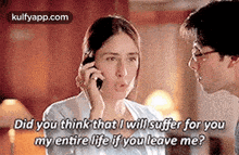 a man and a woman are talking on a cell phone and the woman is talking on the phone .