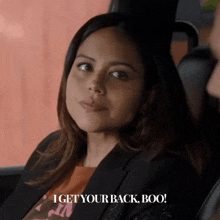 a woman in a car with the words i get your back boo below her