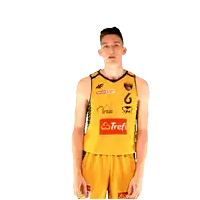 a man flexes his muscles wearing a yellow shirt with trefl on it
