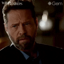 a man with a beard is saying what does that all mean .