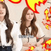 two girls are standing next to each other with the time 9:59 pm