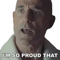 a bald man says " i 'm so proud that " in front of a white background