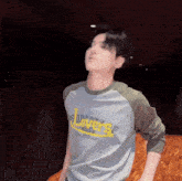 a man wearing a property lovers athletic dept shirt