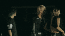 a person wearing a black shirt with the word hba on the waist