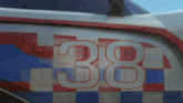 the number 38 is painted on the side of a car