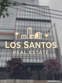 a logo for los santos real estate is displayed in front of a tall building
