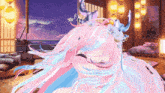 a girl with pink and blue hair and horns is laying on a bed