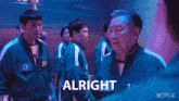 a netflix advertisement shows a group of men standing next to each other and says " you go first then "