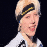a close up of a person wearing a headband that says yellow on it