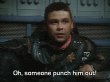 a blurry picture of a man with the words oh someone punch him out