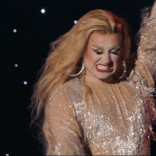 a woman in a sequined dress is making a face