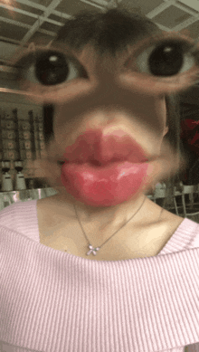 a close up of a woman 's face with a pink lipstick on